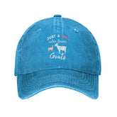 Blue adjustable dad hat with Just A Girl Who Loves Goats design, front view
