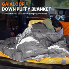 Gaialoop Down Puffy Blanket attached to backpack for versatile on-the-go warmth.