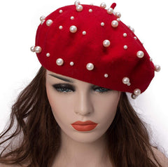 Close-up of faux pearl beads on wool beret