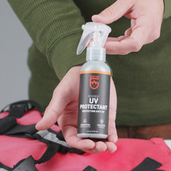 GEAR AID UV Protectant sprayed on a kayak surface to preserve color