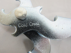 Generic Cold Creek S-Hook Tool held in hand during a trapline task.