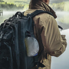 Generic Crampon Case clipped to backpack illustrates hands-free outdoor transport.