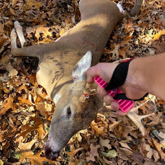 Generic Doe Cuffs loop around leg for secure drag on uneven ground.