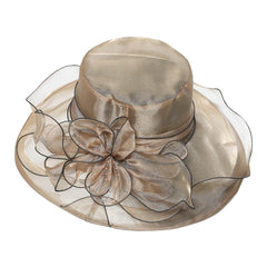 Beige organza Derby hat with fascinator details, ideal for tea parties and bridal showers.