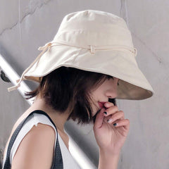 Packable foldable cotton hat fitting easily into a travel bag