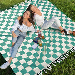 Genovega large picnic blanket folded for travel, compact and stash-friendly.