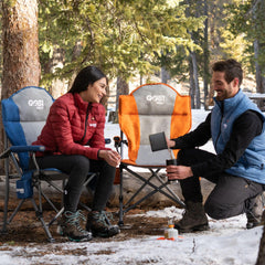 Gobi Heat Terrain chair in use warming outdoors during chilly evening.