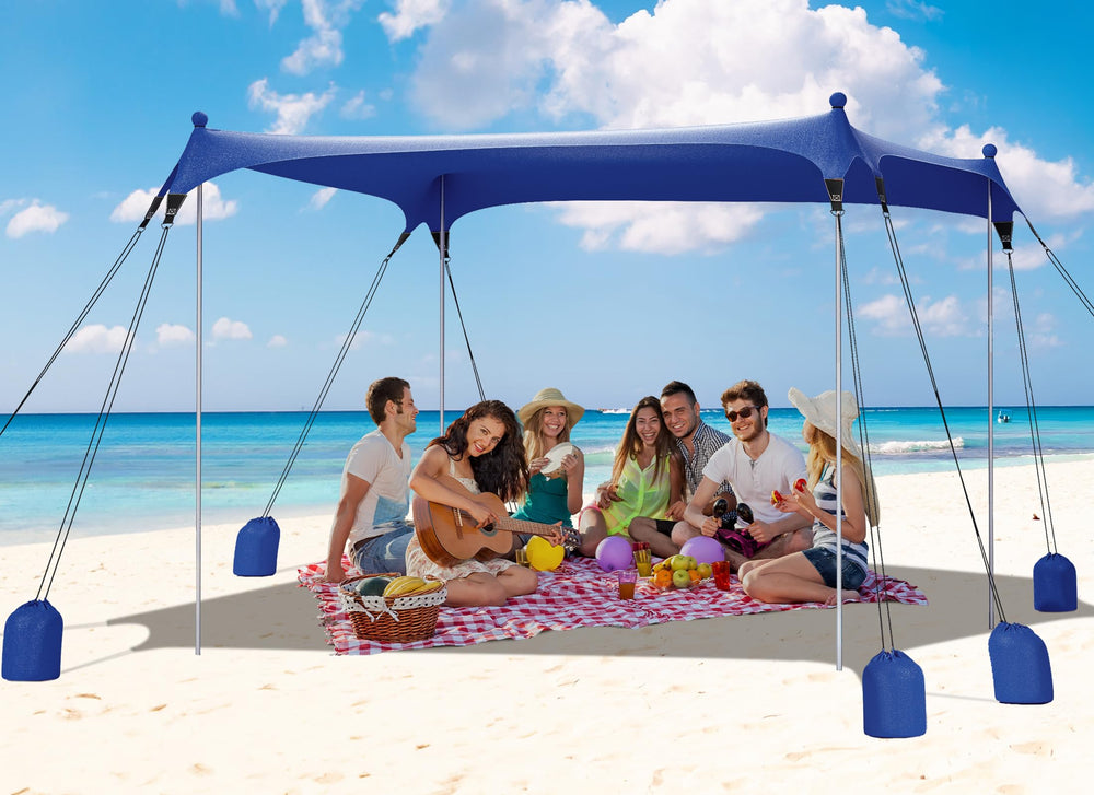 Gorich Beach Tent with 8 detachable sandbags provides stable windproof shade for beach days.