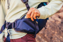 Gregory Jade 28LT ruby-red hip belt provides secure load control on hikes.