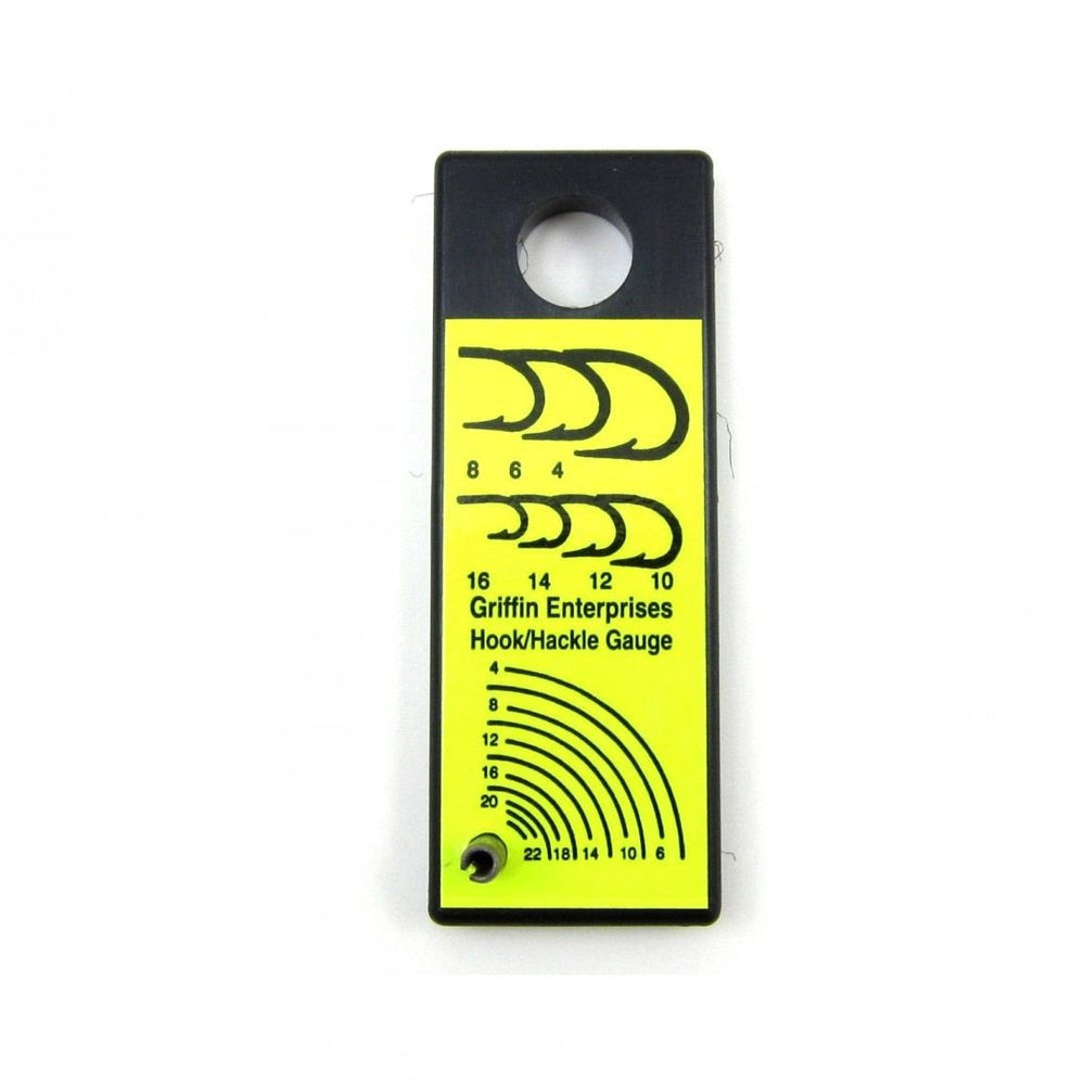 Griffin Hook and Hackle Gauge on bench helps select precise hook sizes for tying.
