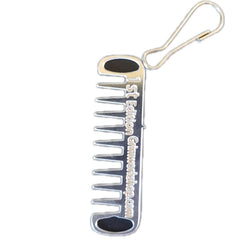 Grim Workshop Comb Micro Tool clipped to a zipper for quick grooming on the go.
