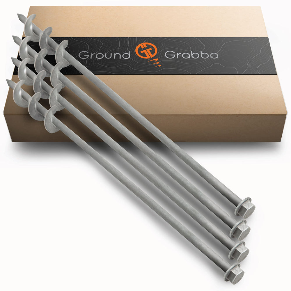 GROUNDGRABBA screw-in tent stake in sand for secure, wind-resistant camping setups