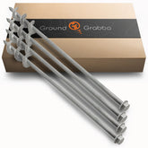 GROUNDGRABBA screw-in tent stake in sand for secure, wind-resistant camping setups