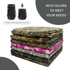 GRVCN military blanket in multiuse setup for camping, picnic, or beach warmth.