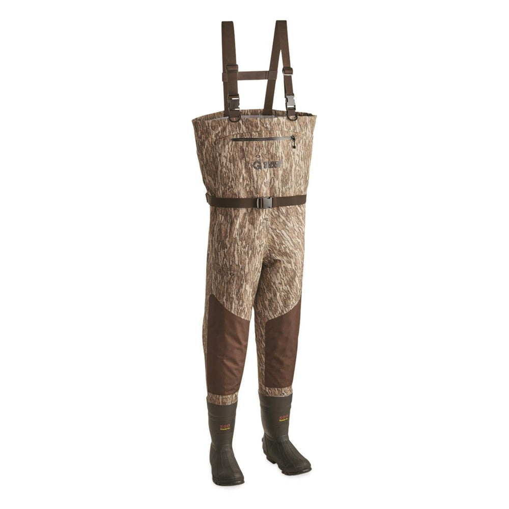 Guide Gear chest waders camo boot close-up showing rugged grip on wet terrain.