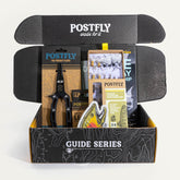 Box open showing 24 premium trout flies inside Guide Series kit
