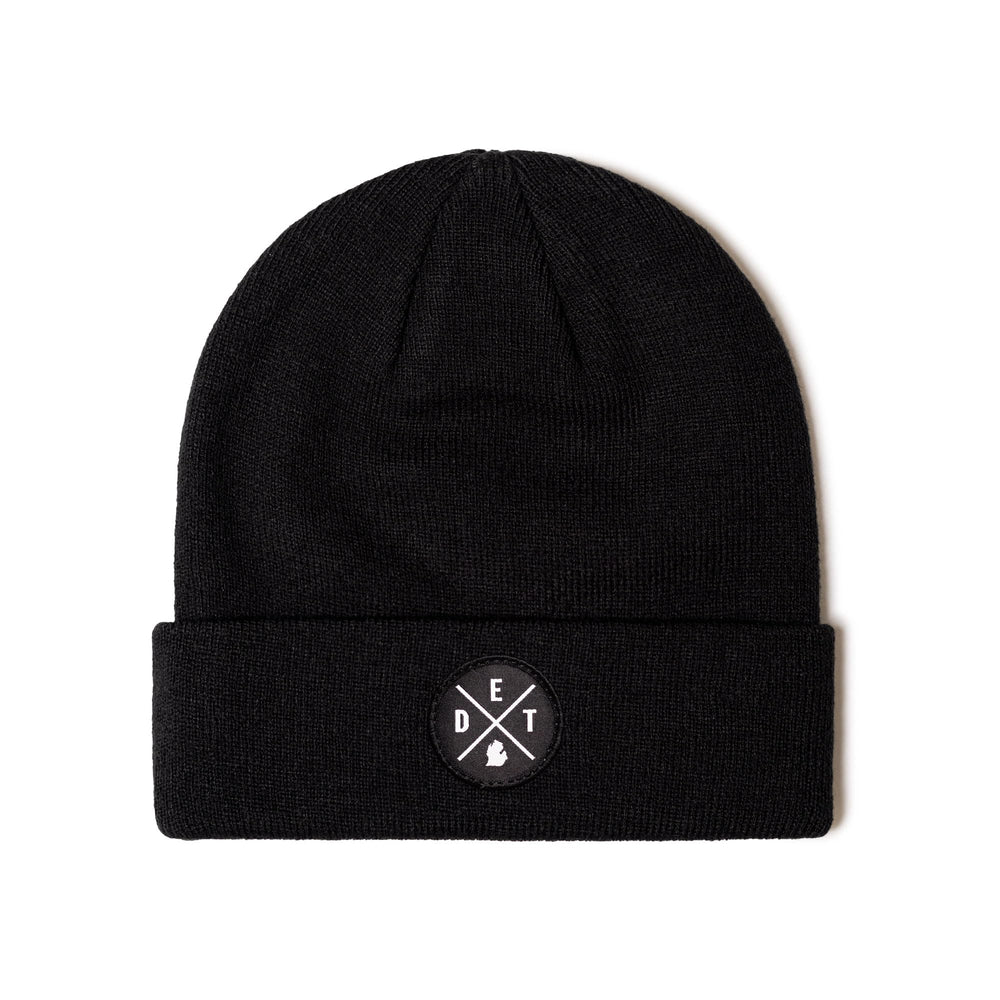 HAKA DET Premium Beanie Black patch detail for durable outdoor wear.