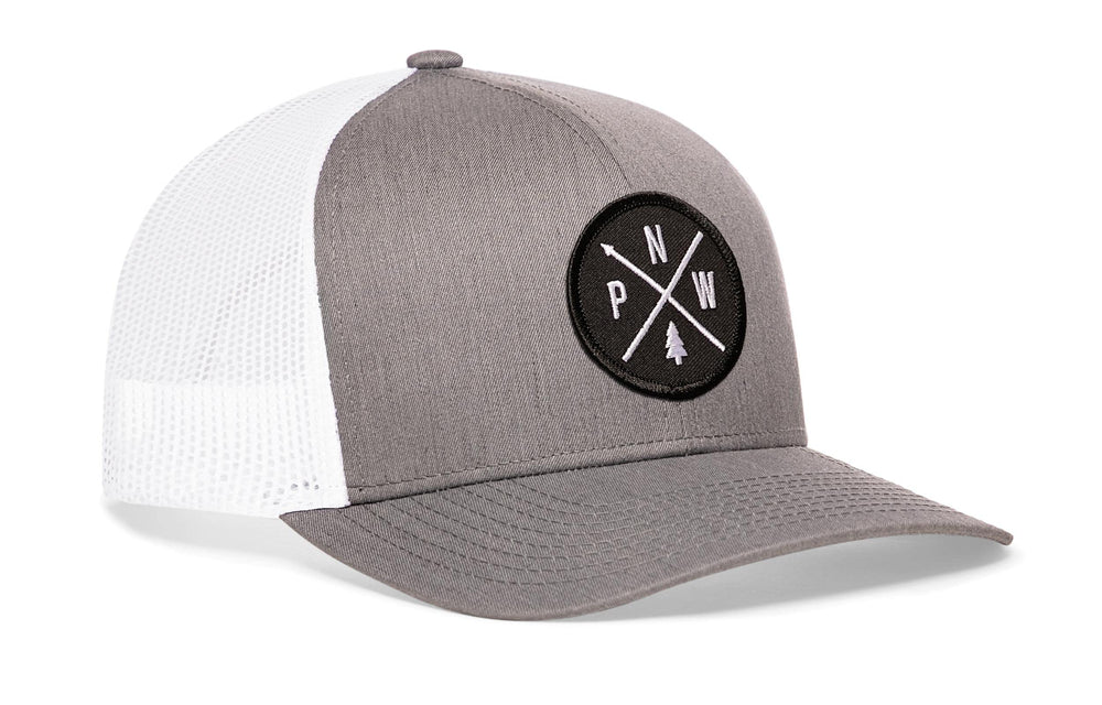 HAKA Pacific Northwest gray and white patch on cap, durable outdoor style for adventures.