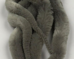 Hareline Dubbin Mangum's Mini Dragon Tail UV2 treated in gray; precise streamer action