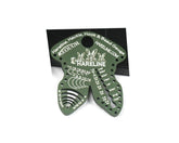 Hareline Dubbin olive gauge tool close-up for precise hook, hackle, and bead sizing.