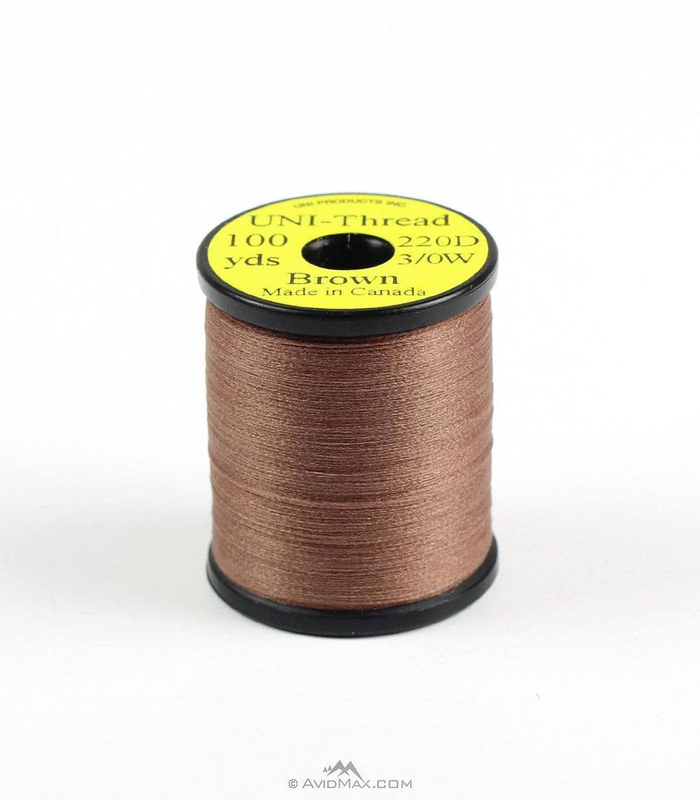 Hareline Dubbin Uni 3/0 Waxed Thread brown spool for durable big-fly tying and reliable wraps.