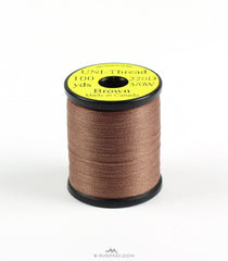 Hareline Dubbin Uni 3/0 Waxed Thread brown spool for durable big-fly tying and reliable wraps.
