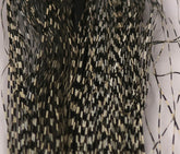 Hareline Dubbin Voodoo Fibers micro-barred black tan closeup highlighting lifelike flash