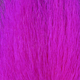 Hareline Large Northern Bucktail in Fl. Cerise #126 with lifelike movement for bass patterns.
