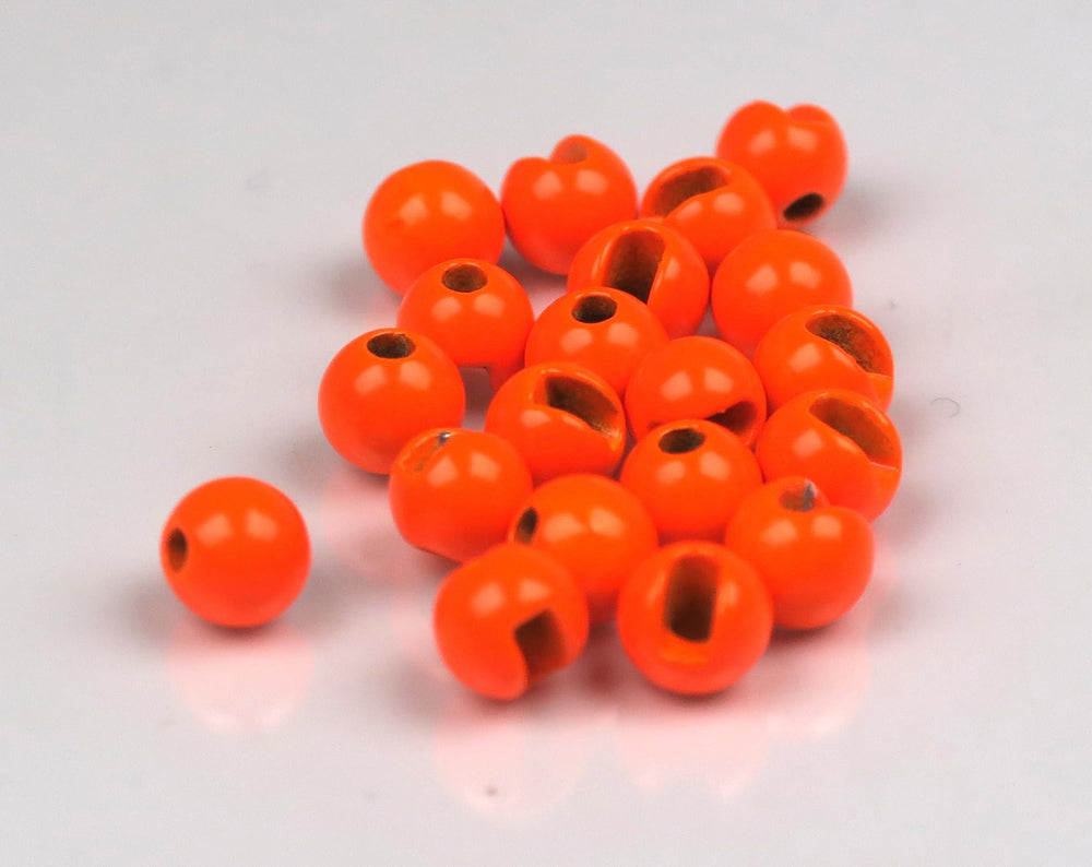 Hareline slotted tungsten beads close-up, precise 7-32 inch size for reliable rigs.