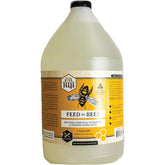 Harvest Lane Honey Feedlq-103 bottle pouring for efficient bee feeding.