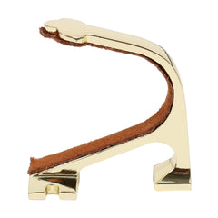 Heavy-duty brass gun rack mounted on a wall