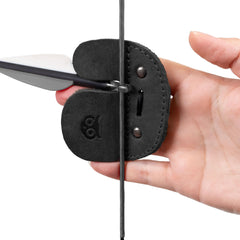 Hide & Drink archery finger tab worn on range highlighting protective comfort