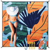 HIHOHO beach blanket 79x83 laid flat for spacious family lounging at the beach.