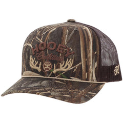 HOOEY Outfitters Realtree camo snapback front logo on outdoor hat for hunting and casual wear.