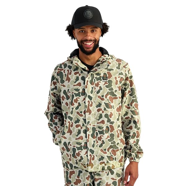 HUK Storm Rain Jacket with adjustable hood ensures secure fit in changing weather