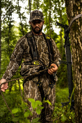 Hunter Safety System bino-range finder straps highlighting accessible optics during hunts
