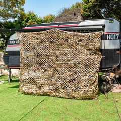 HYOUT camouflage netting woodland setup draped over branches provides versatile concealment and shade.