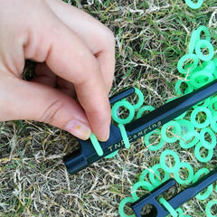 Ifundom night glow tent stake ring highlights stakes against ground, reducing tripping risk