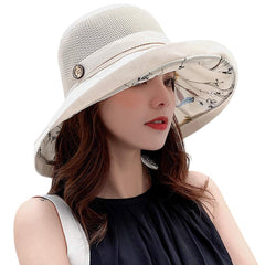 INOGIH women's summer wide-brim hat at the beach provides stylish sun protection.