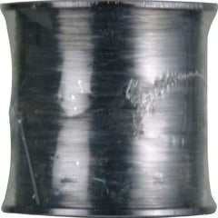 Izor Line Platinum Green spool close-up for bass and salmon fishing, versatile for freshwater and inshore saltwater fishing