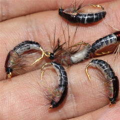 Close-up of Jamyor barbed-hook detail on fly lures.