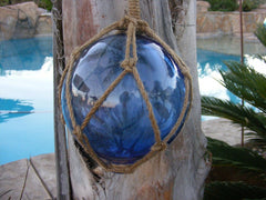 Royal blue Japanese glass fishing float with nautical rope detail - side view