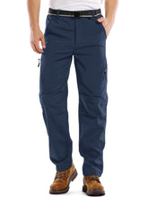 Jessie Kidden men's hiking pants outer layer repels rain and snow for outdoor comfort.