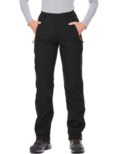 Jessie Kidden women's waterproof pants front view showing sleek shell and protection.