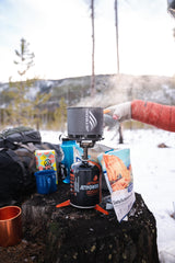 Jetboil JetPower fuel canister on stove, ready for quick boils during trips.