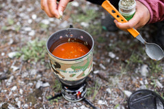 Jetboil MiniMo cooking cup close-up emphasizing efficient FluxRing heat transfer.