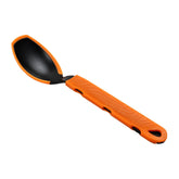 Jetboil TrailSpoon extended handle reaching into a pot for easy serving
