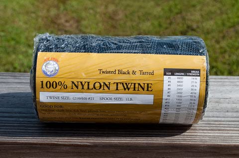 Joy Fish nylon twisted twine in black tarred, ideal for fishing nets and sturdy tying tasks.