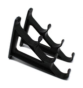 JSP Manufacturing plastic horizontal rod wall rack mounted on wall holding three rods for organized storage.