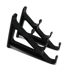 JSP Manufacturing plastic horizontal rod wall rack mounted on wall holding three rods for organized storage.